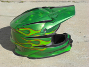 Green dirtbike helmet with stars and old school flames