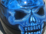 True fire blue skull full face motorcycle helmet with spine and brain exposed as well as airbushed visor.