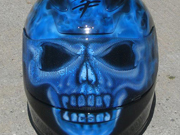 True fire blue skull full face motorcycle helmet with spine and brain exposed as well as airbushed visor.